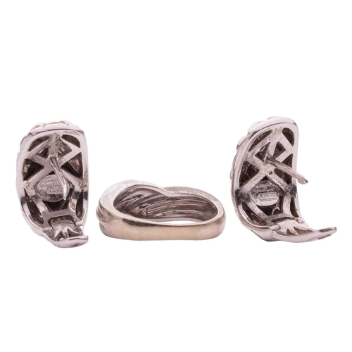 9 - A dress ring and a pair of earrings; the ring of twisted and textured design is in size M; with a pa... 