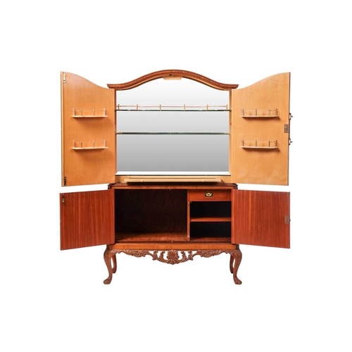 100 - A mid-20th century burr walnut four-door cocktail cabinet, with mirrored and shelved interior to the... 