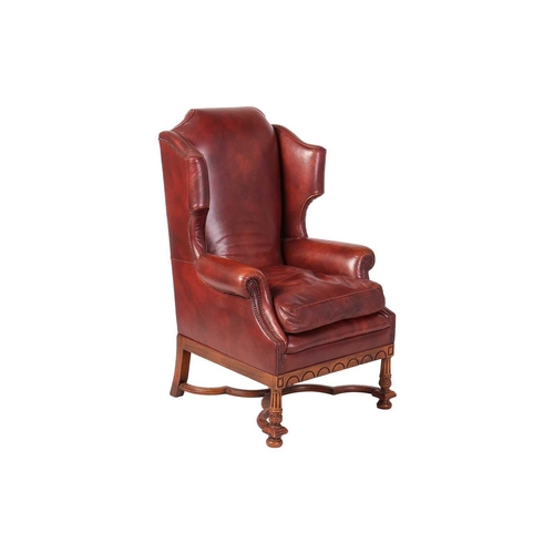 108 - A craftsman-made William III-style hide-covered wingback armchair, possibly Brights of Nettlebed (Ox... 