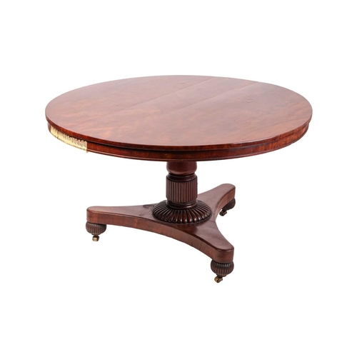 110 - A George IV mahogany snap-top circular breakfast table, on a triform base with reeded bun feet. 129 ... 