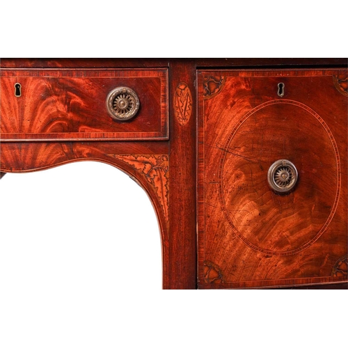 114 - A George III mahogany small bowfront kneehole sideboard, with a central frieze drawer and two deep s... 