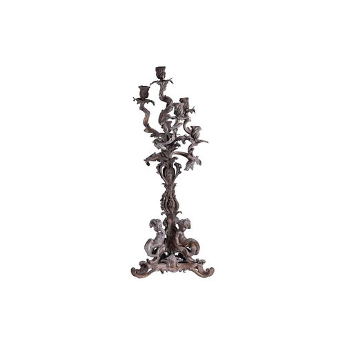 125 - A large late 19th century patinated bronze candelabra, the six sconces on leaf scroll entwined arms,... 