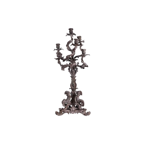 125 - A large late 19th century patinated bronze candelabra, the six sconces on leaf scroll entwined arms,... 