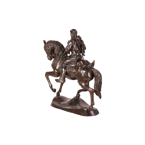 126 - A very large patinated bronze figure of an Arab figure on a horse, 20th century, after Antoine-Louis... 