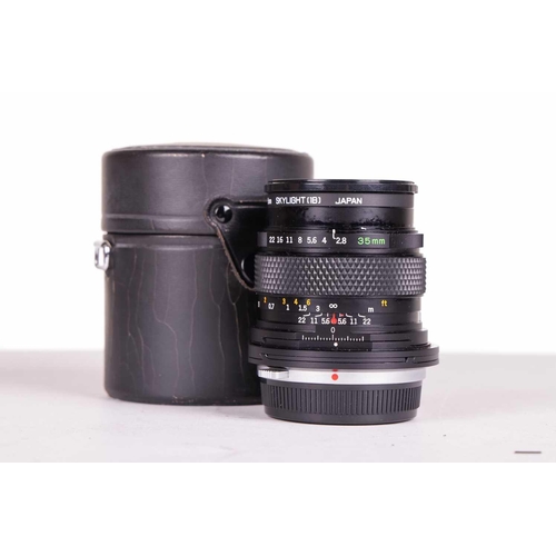 147 - A large collection of Olympus OM System camera lenses, comprising: Zuiko Auto-Macro 135mm F4.5, Zuik... 