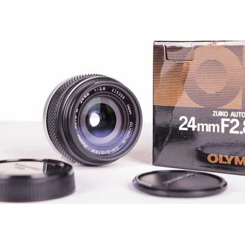 147 - A large collection of Olympus OM System camera lenses, comprising: Zuiko Auto-Macro 135mm F4.5, Zuik... 