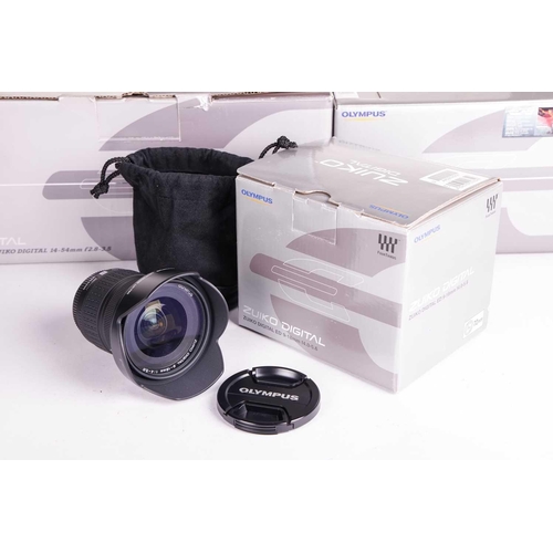 148 - A collection of Olympus Digital Camera items, all boxed with accessories, and apparently unused, com... 