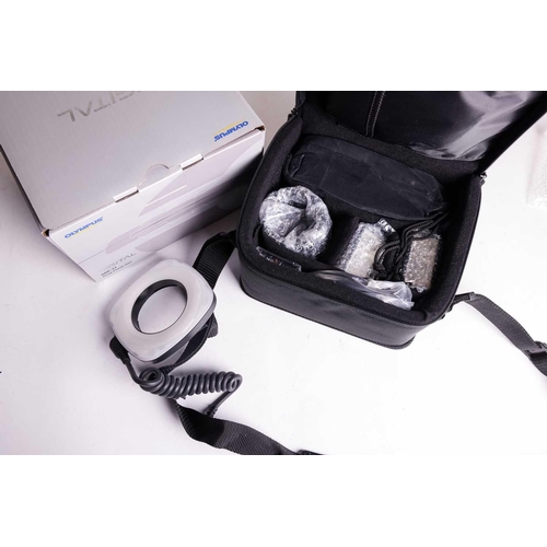 148 - A collection of Olympus Digital Camera items, all boxed with accessories, and apparently unused, com... 