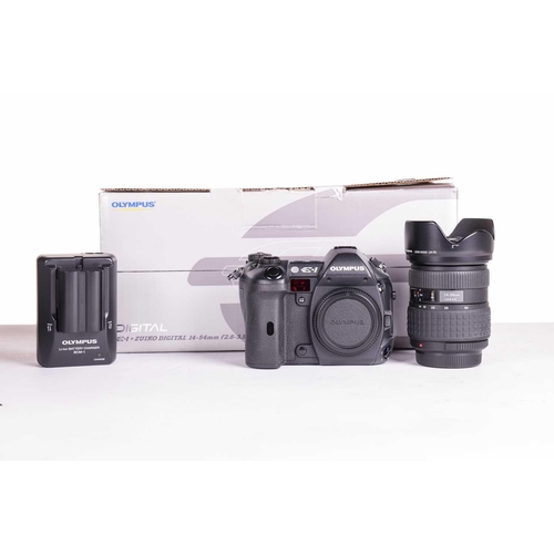 148 - A collection of Olympus Digital Camera items, all boxed with accessories, and apparently unused, com... 