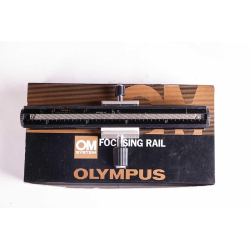 157 - A large collection of boxed Olympus OM System cameras and accessories, comprising: an OM-4 Ti camera... 