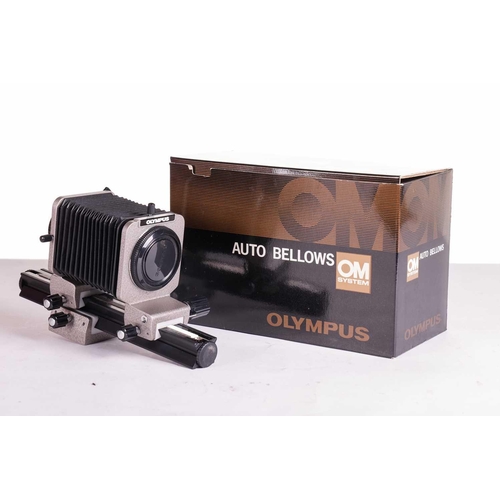 157 - A large collection of boxed Olympus OM System cameras and accessories, comprising: an OM-4 Ti camera... 