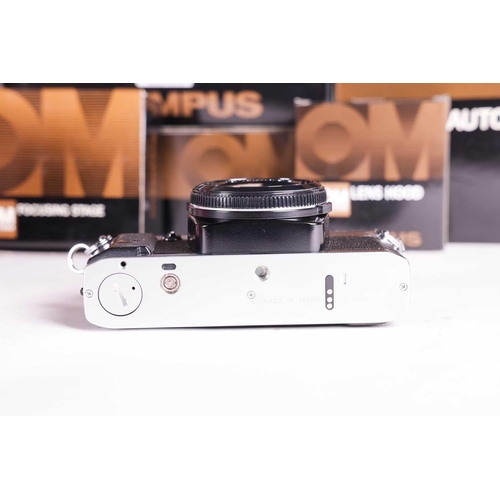 157 - A large collection of boxed Olympus OM System cameras and accessories, comprising: an OM-4 Ti camera... 