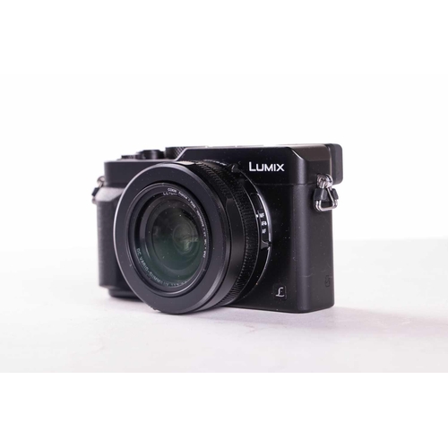 164 - A large collection of boxed cameras and equipment, comprising a Panasonic GF1 Lumix G Vario Lens Kit... 