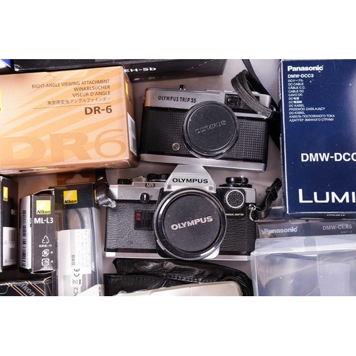 164 - A large collection of boxed cameras and equipment, comprising a Panasonic GF1 Lumix G Vario Lens Kit... 