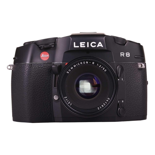 167 - A Leica R8 SLR Camera, 2000, black, serial no. 2476807, in original box with warranty paperwork (now... 