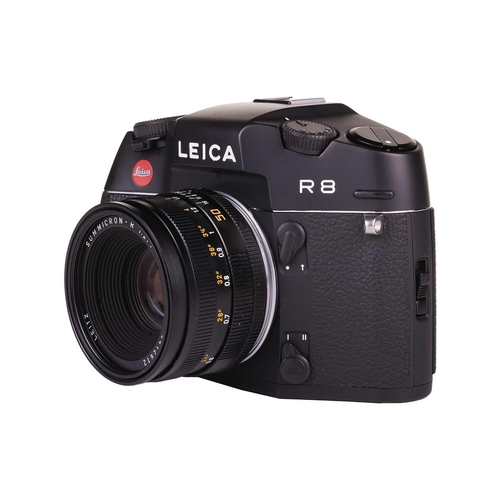 167 - A Leica R8 SLR Camera, 2000, black, serial no. 2476807, in original box with warranty paperwork (now... 