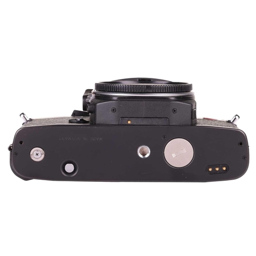 169 - A Leica R6 SLR Camera body, 1987, Made in Germany, black, serial no. 1729282, in original case and b... 