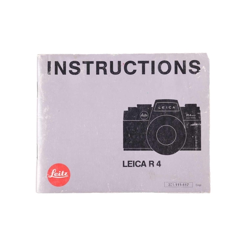 171 - A Leica R4 camera, black, 1983, serial number 1623372, with original instruction booklet, fitted wit... 