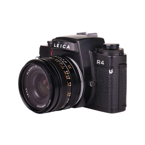 171 - A Leica R4 camera, black, 1983, serial number 1623372, with original instruction booklet, fitted wit... 