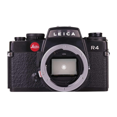 171 - A Leica R4 camera, black, 1983, serial number 1623372, with original instruction booklet, fitted wit... 