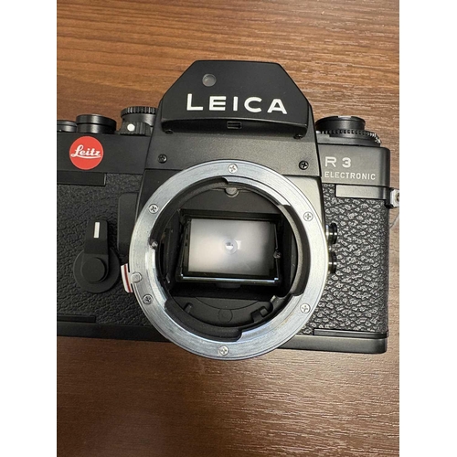 172 - A Leica R3 Electronic Camera body, No.1463715, made in Portugal, in black, with paperwork manual, ta... 