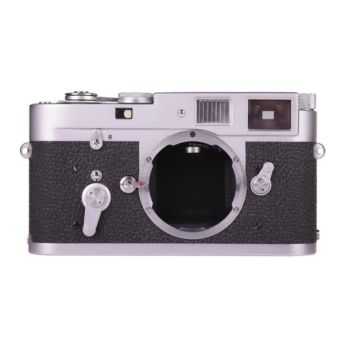 182 - A Leica M2 Rangefinder Camera Body, 1964, chrome, serial number 1092949, with brown leather Leica ca... 