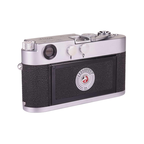 182 - A Leica M2 Rangefinder Camera Body, 1964, chrome, serial number 1092949, with brown leather Leica ca... 