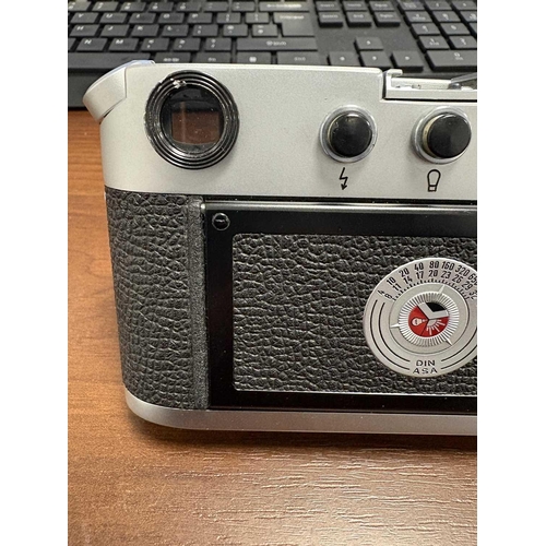 184 - A Leica M4 Rangefinder Camera,1970, chrome, serial no. 1207564, fitted with a Leitz Elmar 1:2.8/50mm... 