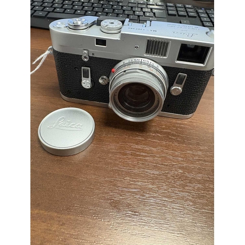 184 - A Leica M4 Rangefinder Camera,1970, chrome, serial no. 1207564, fitted with a Leitz Elmar 1:2.8/50mm... 