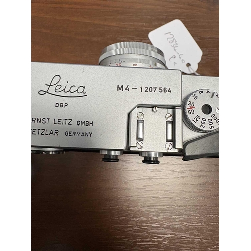 184 - A Leica M4 Rangefinder Camera,1970, chrome, serial no. 1207564, fitted with a Leitz Elmar 1:2.8/50mm... 