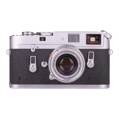 184 - A Leica M4 Rangefinder Camera,1970, chrome, serial no. 1207564, fitted with a Leitz Elmar 1:2.8/50mm... 