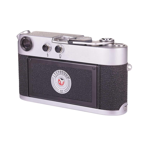 184 - A Leica M4 Rangefinder Camera,1970, chrome, serial no. 1207564, fitted with a Leitz Elmar 1:2.8/50mm... 