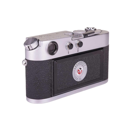 184 - A Leica M4 Rangefinder Camera,1970, chrome, serial no. 1207564, fitted with a Leitz Elmar 1:2.8/50mm... 