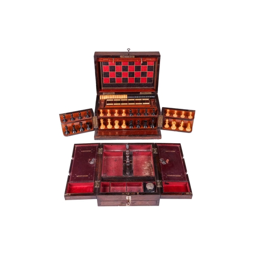 191 - A Victorian rosewood games compendium, with hinged cover and twin front doors, opening to reveal box... 