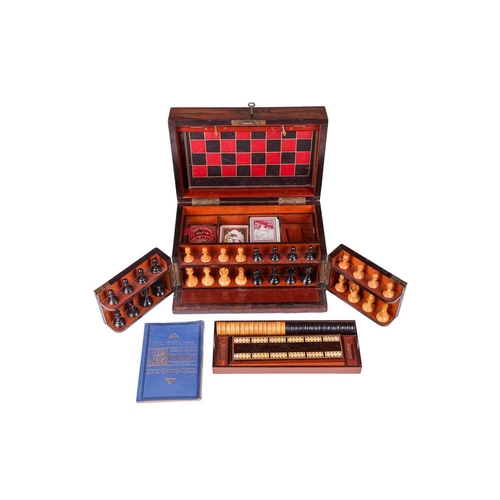 191 - A Victorian rosewood games compendium, with hinged cover and twin front doors, opening to reveal box... 