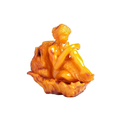 194 - A carved Amber (reconstituted Baltic ?) figure group of Leda & the Swan, 16 cm long x 13 cm high, 33... 