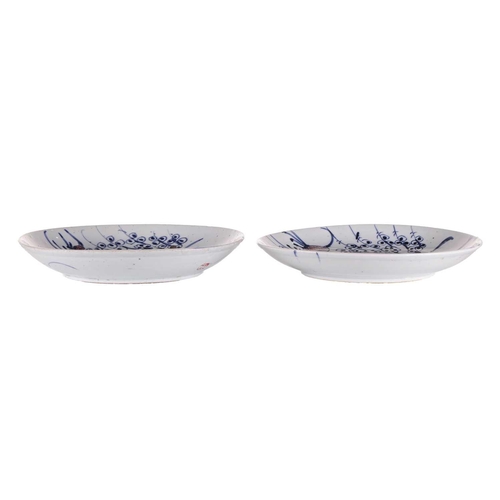 68 - A pair of Chinese porcelain cobalt blue and iron red saucer dishes, Qing Dynasty, late 19th century,... 