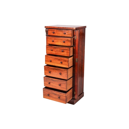 71 - A well-figured Victorian rosewood Wellington pedestal chest of seven drawers, secured by a single lo... 