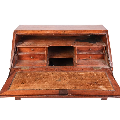 77 - A late 18th-century Italian walnut parquetry bureau, with a quartered fall opening to reveal a stepp... 