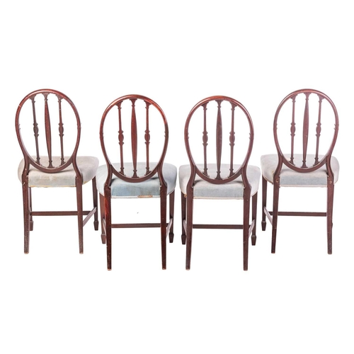 78 - A set of four George III style mahogany dining chairs of Hepplewhite design, with oval backs, carved... 