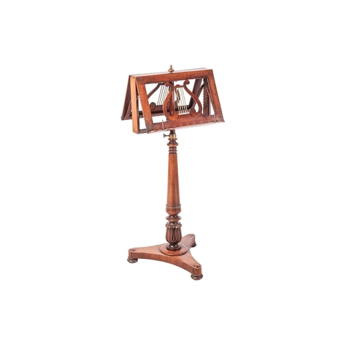 82 - A George IV mahogany duet stand, brass mounted with rise and fall movement, on an inverted tapering ... 