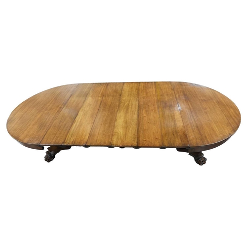 83 - A 19th-century American extending circular mahogany dining table in the manner of Charles Hobe with ... 