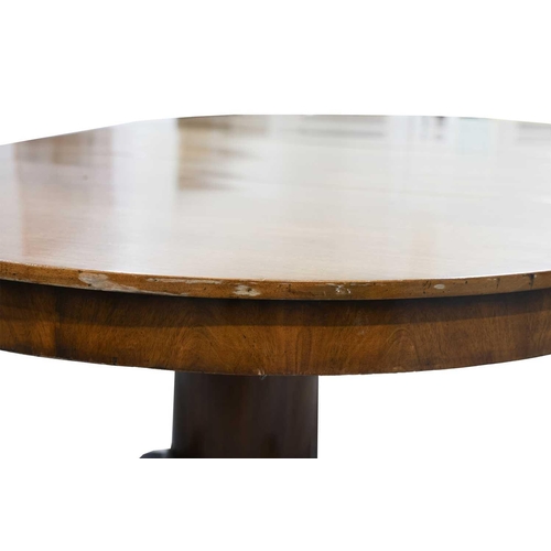 83 - A 19th-century American extending circular mahogany dining table in the manner of Charles Hobe with ... 