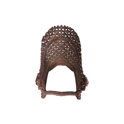 88 - An Anglo-Indian carved hardwood armchair, late 19th century, with lattice work back and front rail, ... 