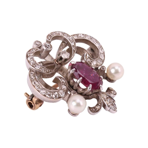 1 - A late Victorian gem-set brooch, of scrollwork design, centred with an oval-cut ruby, to an openwork... 