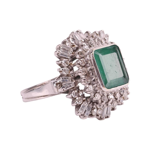 113 - An emerald and diamond ballerina ring, centred with a rectangular portrait-cut emerald with canted c... 