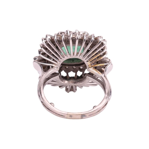 113 - An emerald and diamond ballerina ring, centred with a rectangular portrait-cut emerald with canted c... 