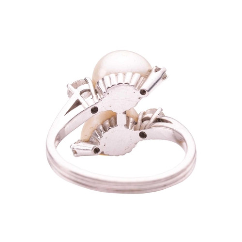 117 - Gübelin - a cultured pearl and diamond crossover ring, comprising two egg-shaped cultured pearls of ... 