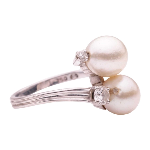 117 - Gübelin - a cultured pearl and diamond crossover ring, comprising two egg-shaped cultured pearls of ... 