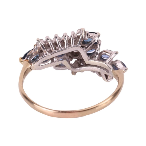 12 - A sapphire and diamond crossover cluster ring, comprising of a central claw-set brilliant-cut diamon... 